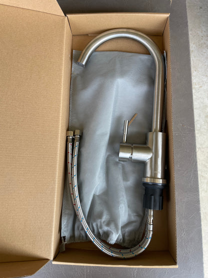 Single hole kitchen faucet by Utopia. Water lines included