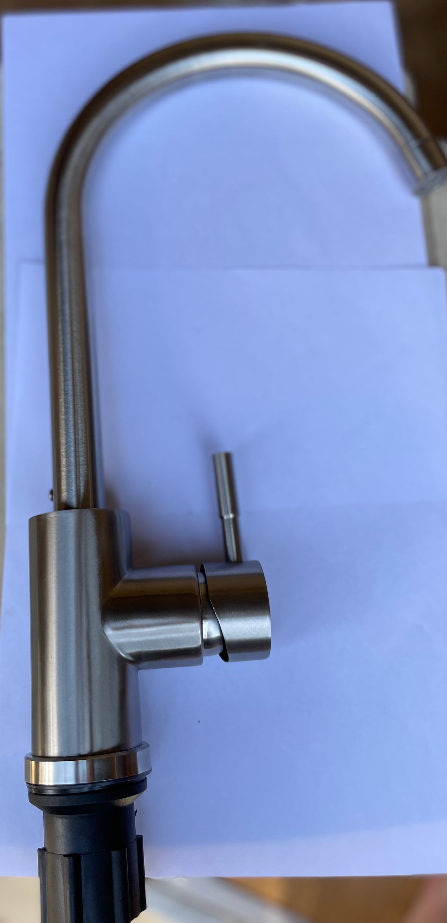 Single hole kitchen faucet by Utopia. Water lines included